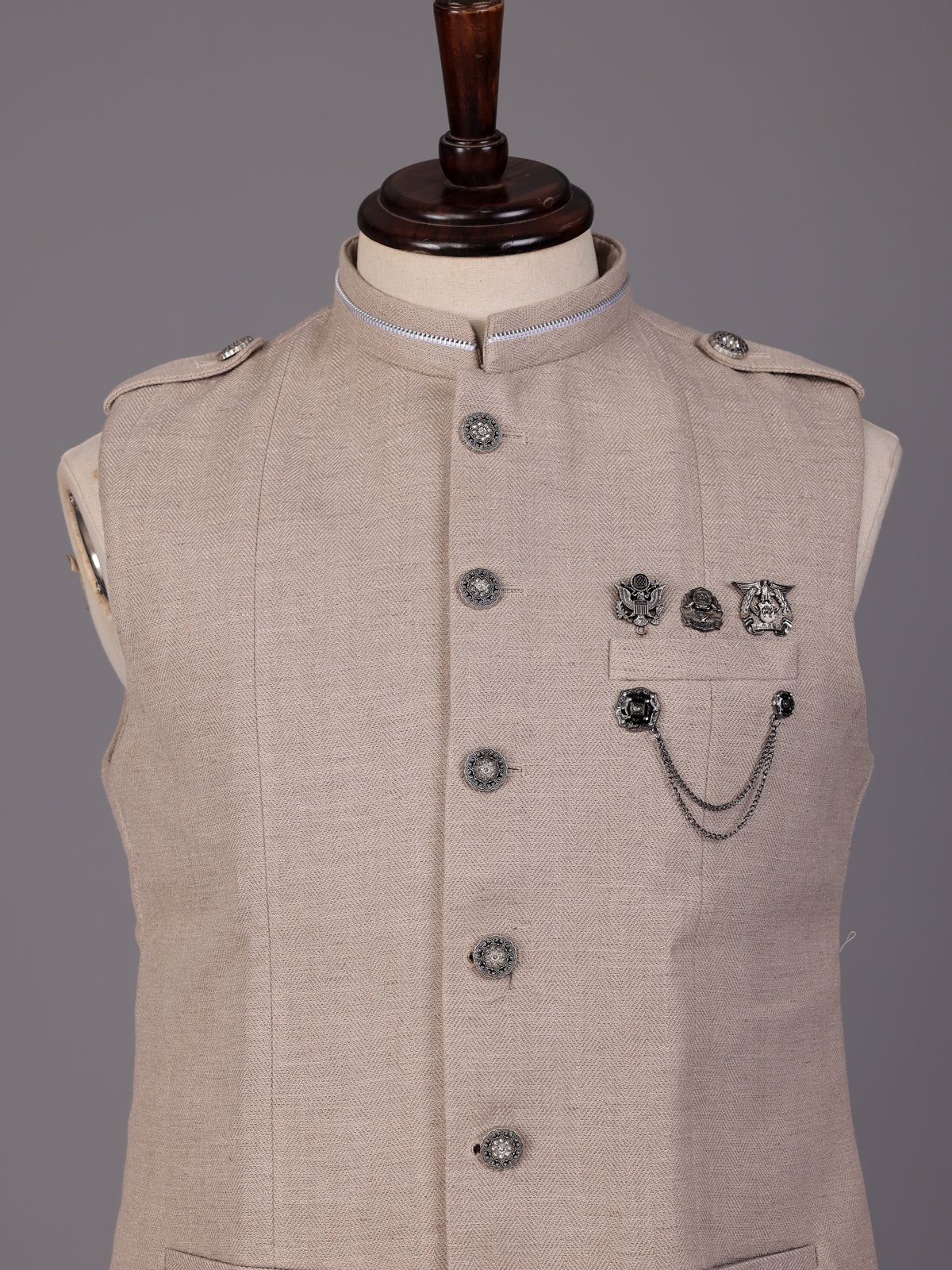 Beige textured waistcoat with metallic chain brooch detailing for mens
