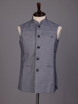 Grey micro-textured waistcoat with metallic brooch for mens weddings