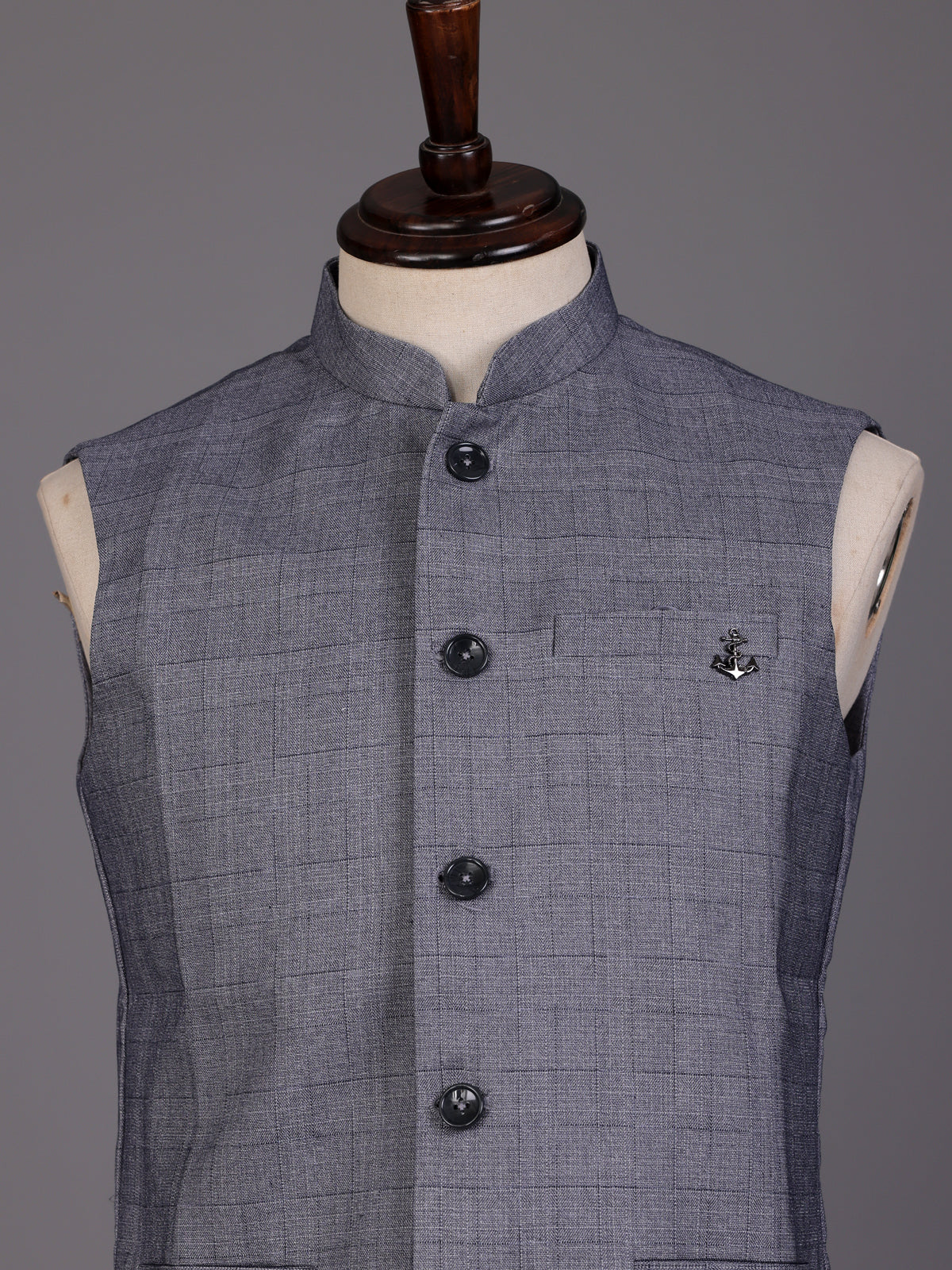 Grey micro-textured waistcoat with metallic brooch for mens weddings