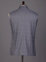 Grey micro-textured waistcoat with metallic brooch for mens weddings