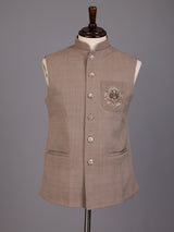 Dark beige textured waistcoat with zardosi safari pocket detailing