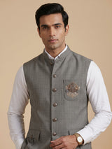 Grey textured zardosi waistcoat with safari pocket detailing for mens