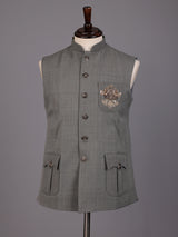 Grey textured zardosi waistcoat with safari pocket detailing for mens