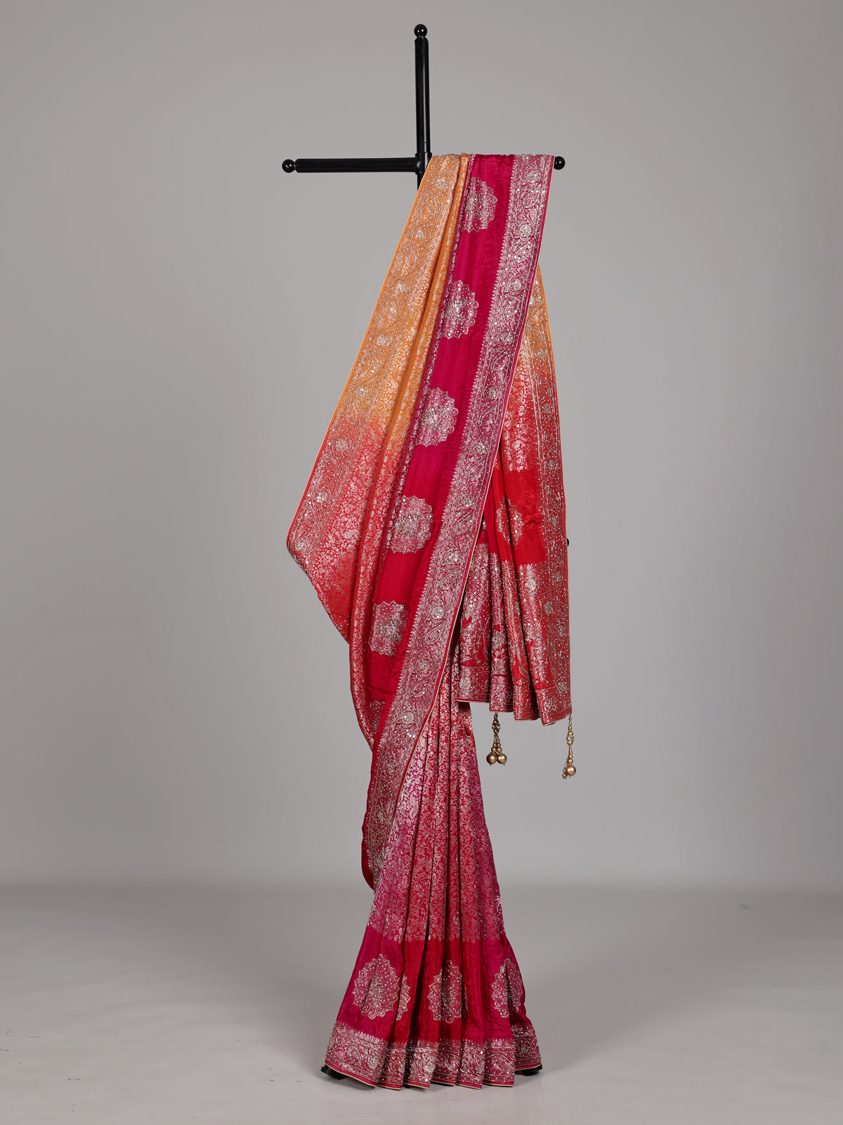 Red and yellow shaded embellished dola silk saree