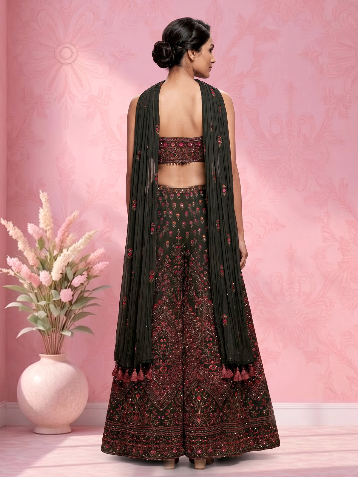 Dark mehendi green georgette palazzo suit with heavy festive embellishments