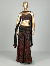 Dark mehendi green georgette palazzo suit with heavy festive embellishments