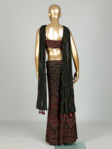 Dark mehendi green georgette palazzo suit with heavy festive embellishments
