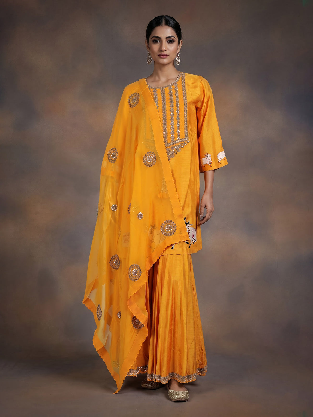 Mustard yellow silk sharara suit with animal motifs and gota work
