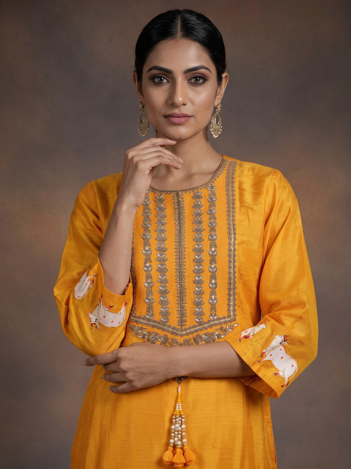 Mustard yellow silk sharara suit with animal motifs and gota work