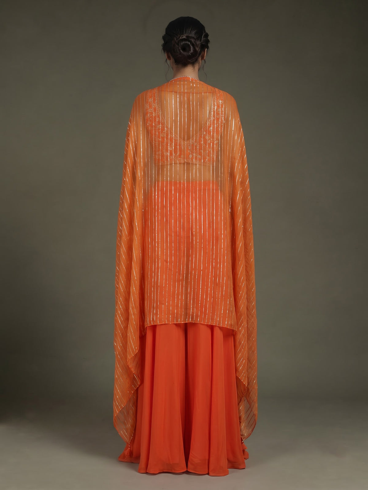 Orange satin silk designer salwar suit with embellished shrug