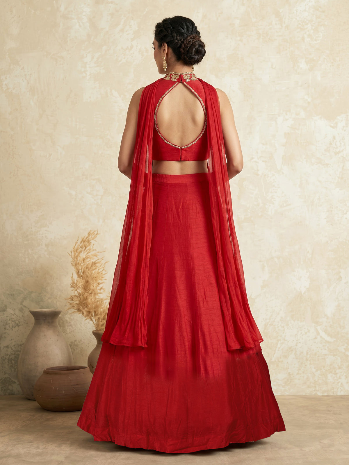 Red designer silk lehenga choli with tassel embellishments