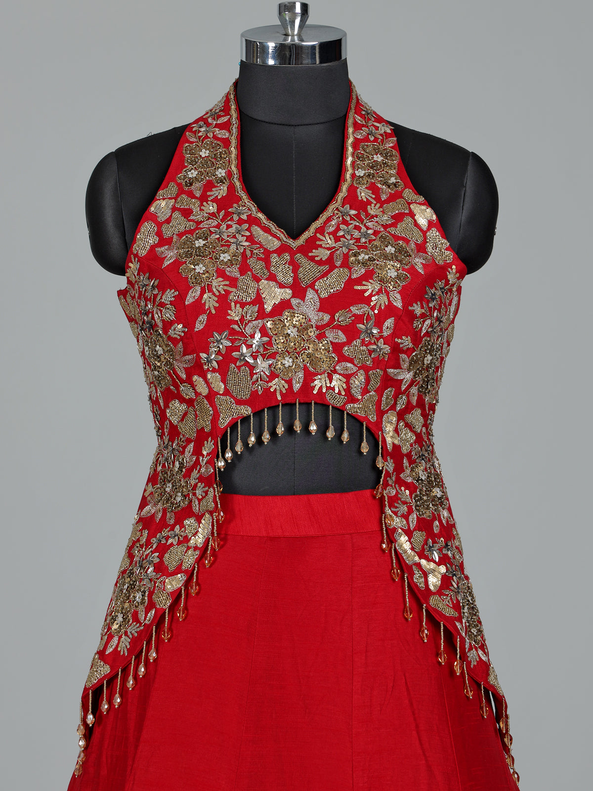 Red designer silk lehenga choli with tassel embellishments