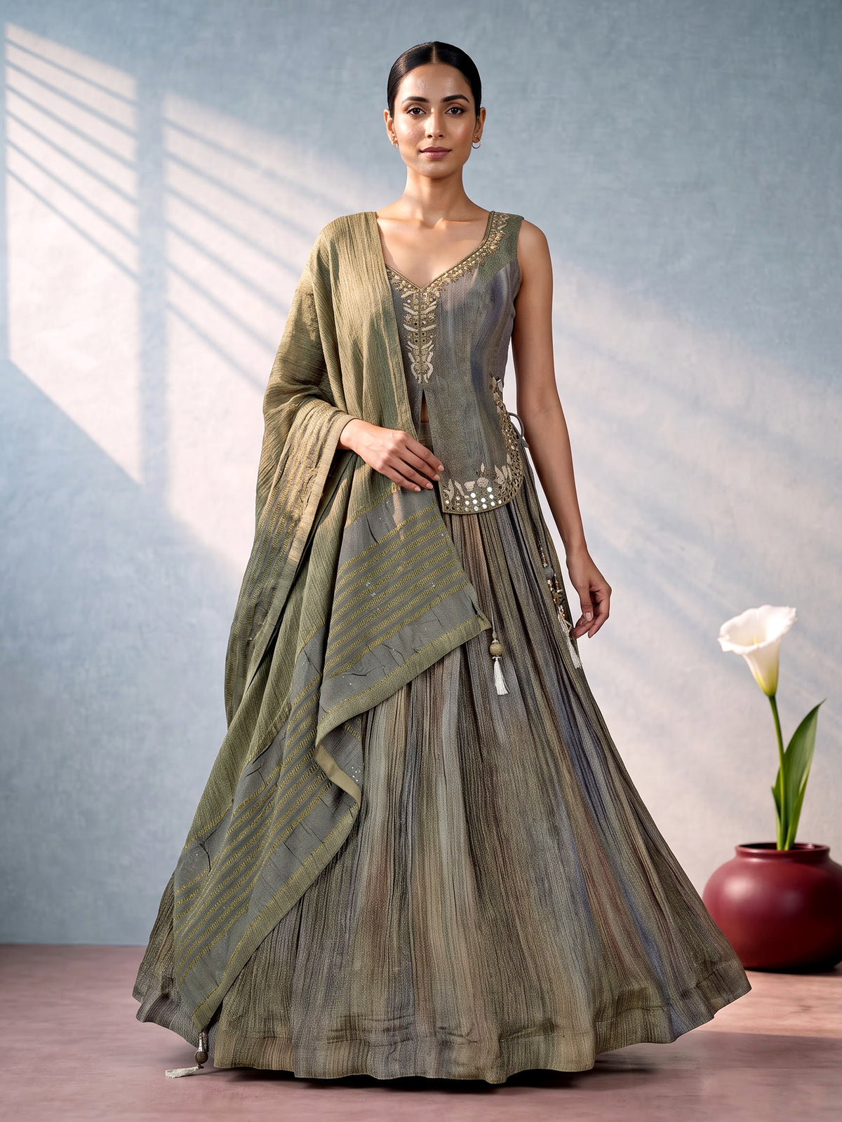 Mehendi green shaded silk lehenga choli with ornate embellishments
