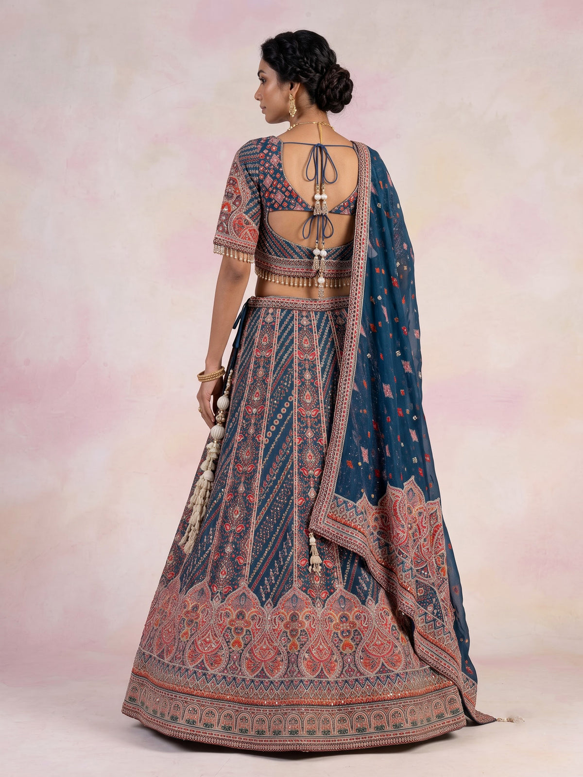 Rama blue silk lehenga choli with chevron panels and embellishments