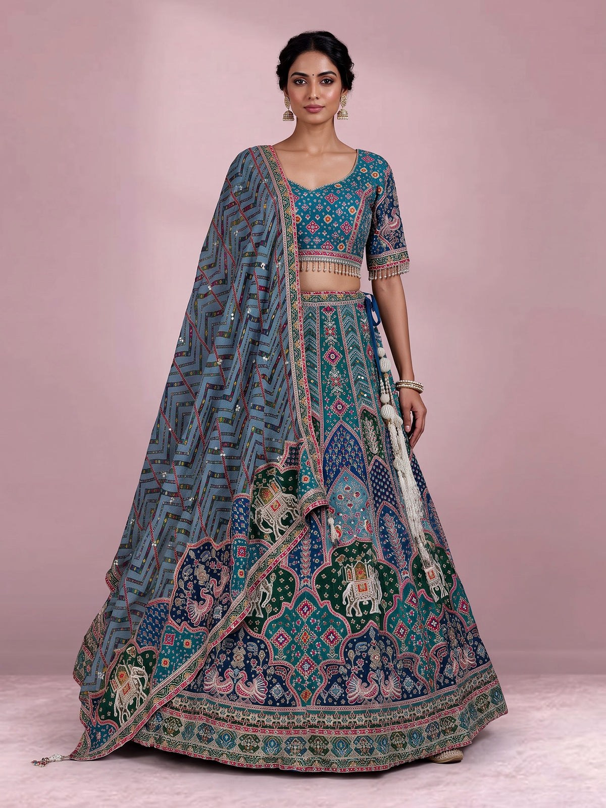 Rama green silk lehenga choli with bandhani patola detailing