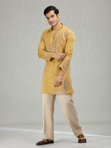 Yellow radiant wave ornamentation men kurta suit