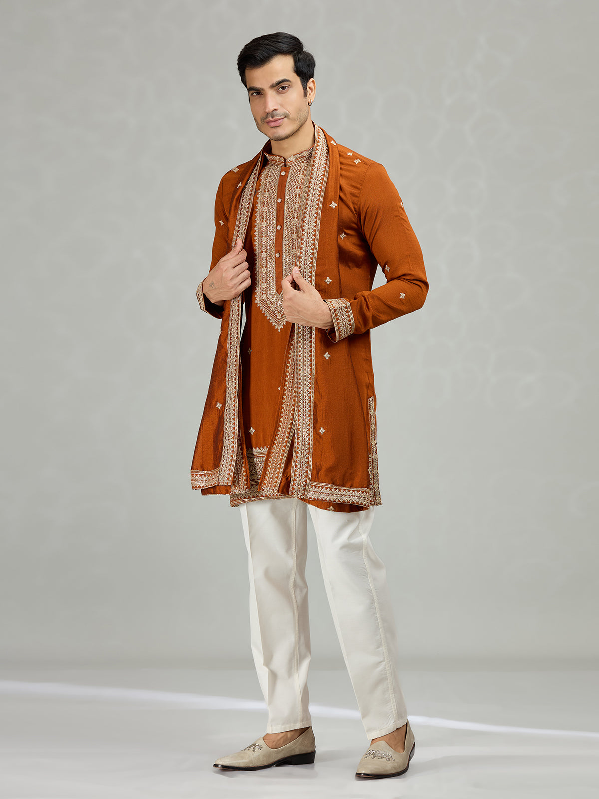Rust orange statement embroidered men kurta suit