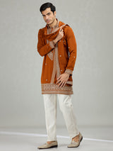 Rust orange statement embroidered men kurta suit