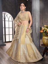 Gold silk lehenga choli with elegant peacock motif embellishments