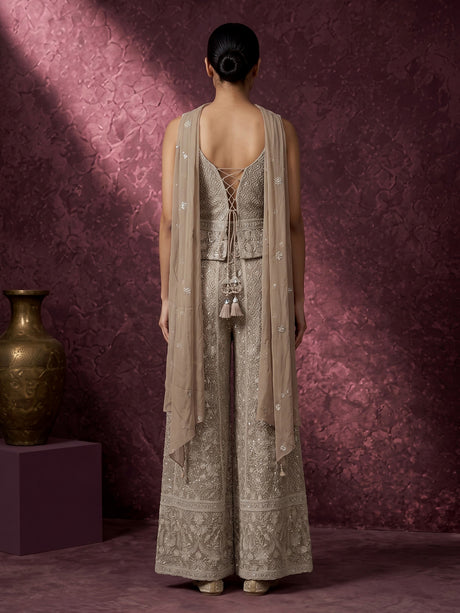 Beige georgette pakistani salwar suit with sparkling mirror embellishments