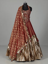 Rust red silk lehenga choli with intricate aabla embroidery