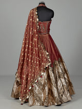 Rust red silk lehenga choli with intricate aabla embroidery