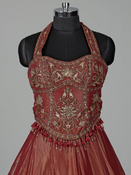 Rust red silk lehenga choli with intricate aabla embroidery