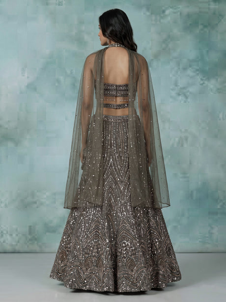 Dark mehendi green silk lehenga choli with diamond embellishments