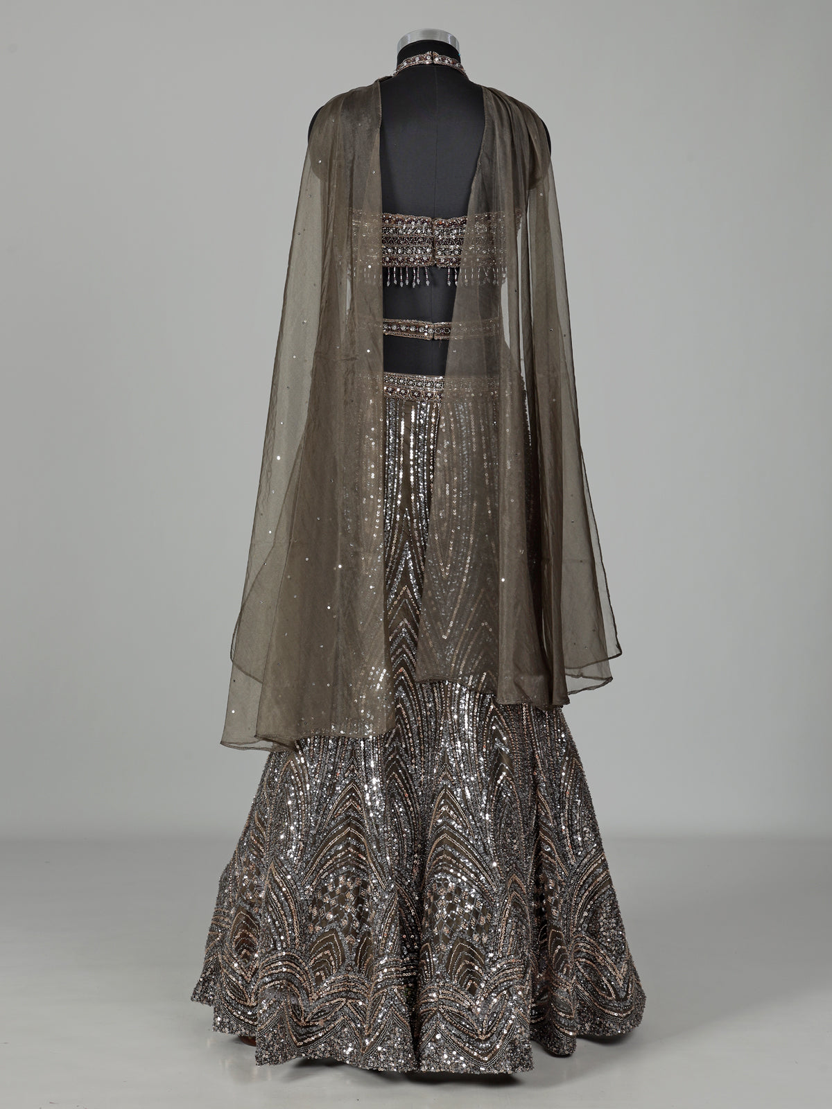 Dark mehendi green silk lehenga choli with diamond embellishments