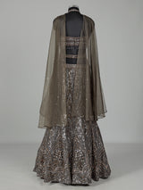 Dark mehendi green silk lehenga choli with diamond embellishments