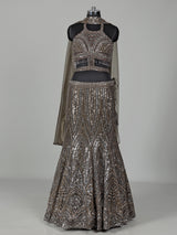Dark mehendi green silk lehenga choli with diamond embellishments
