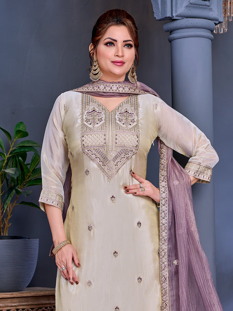 Cream shimmer salwar suit with purple contrast dupatta and yoke detailing