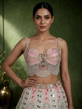 Beige silk lehenga choli with pearl and diamond embellishments