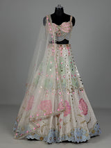 Beige silk lehenga choli with pearl and diamond embellishments