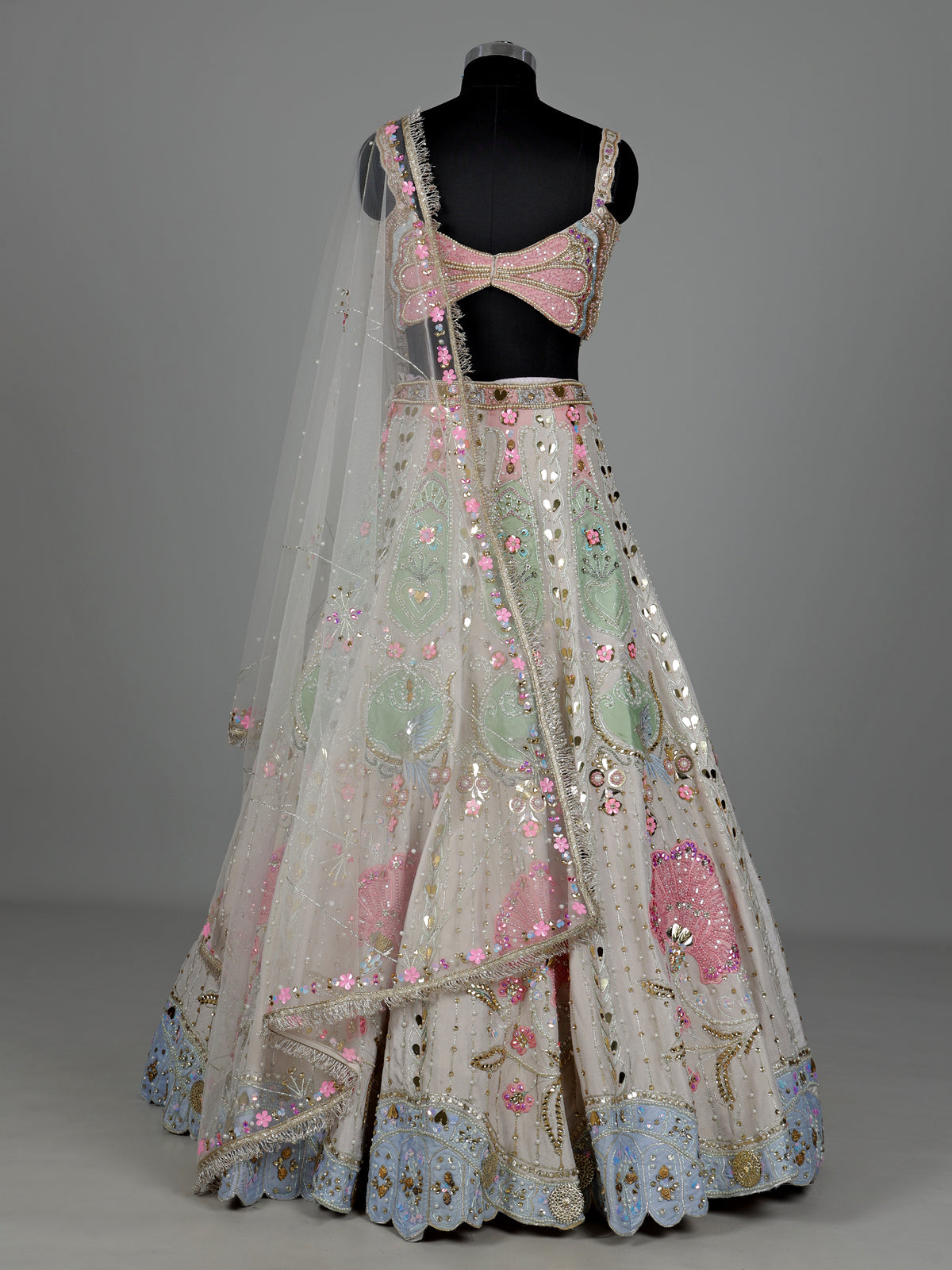 Beige silk lehenga choli with pearl and diamond embellishments