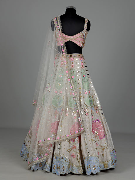 Beige silk lehenga choli with pearl and diamond embellishments