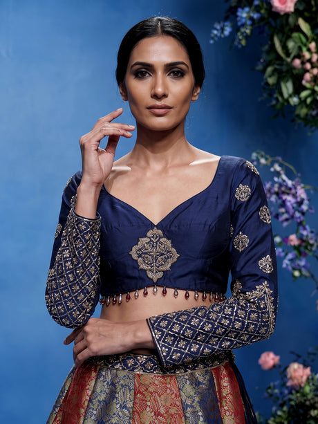Navy blue brocade lehenga choli with mirror and zari embellishments