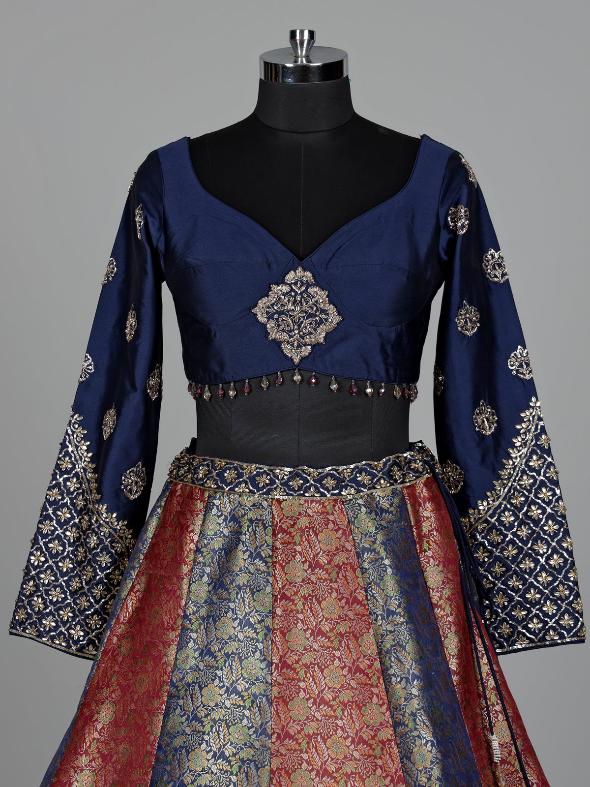 Navy blue brocade lehenga choli with mirror and zari embellishments