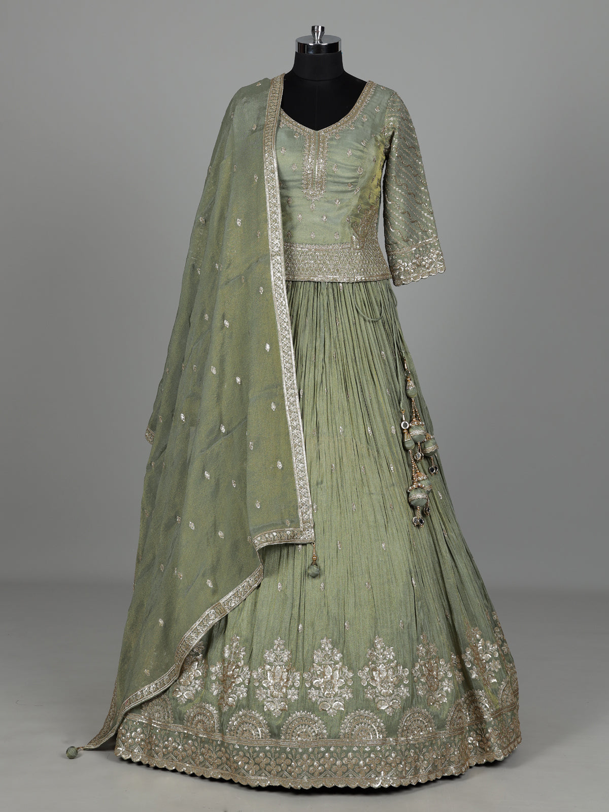 Pista green silk lehenga choli with sparkling zardosi embellishments