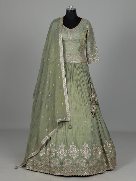 Pista green silk lehenga choli with sparkling zardosi embellishments