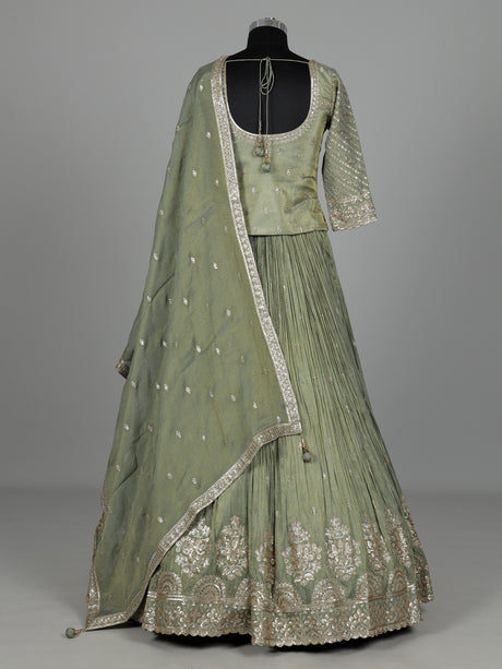 Pista green silk lehenga choli with sparkling zardosi embellishments
