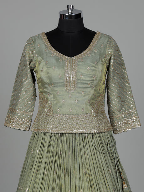 Pista green silk lehenga choli with sparkling zardosi embellishments