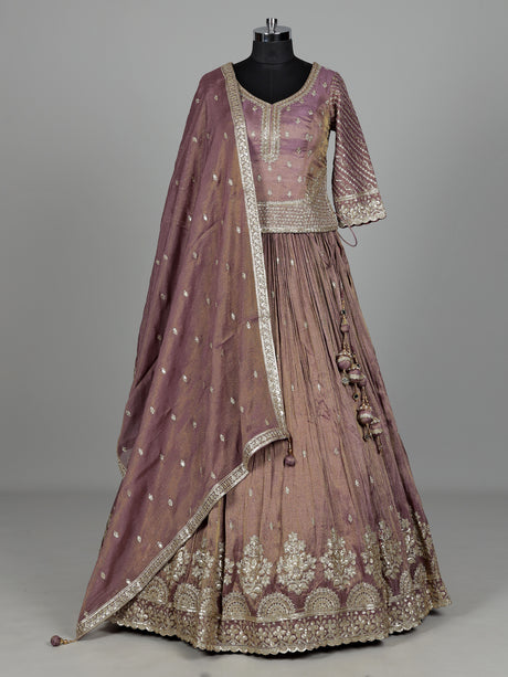 Pastel purple silk lehenga choli with intricate zardosi work