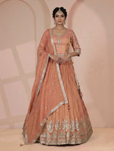 Pastel peach silk lehenga choli with elegant zardosi embroidery