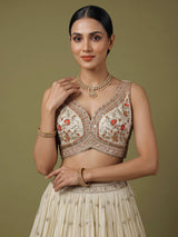 Beige silk lehenga choli with mirror work and contrast dupatta