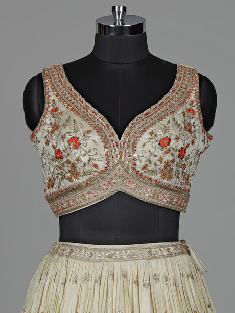Beige silk lehenga choli with mirror work and contrast dupatta