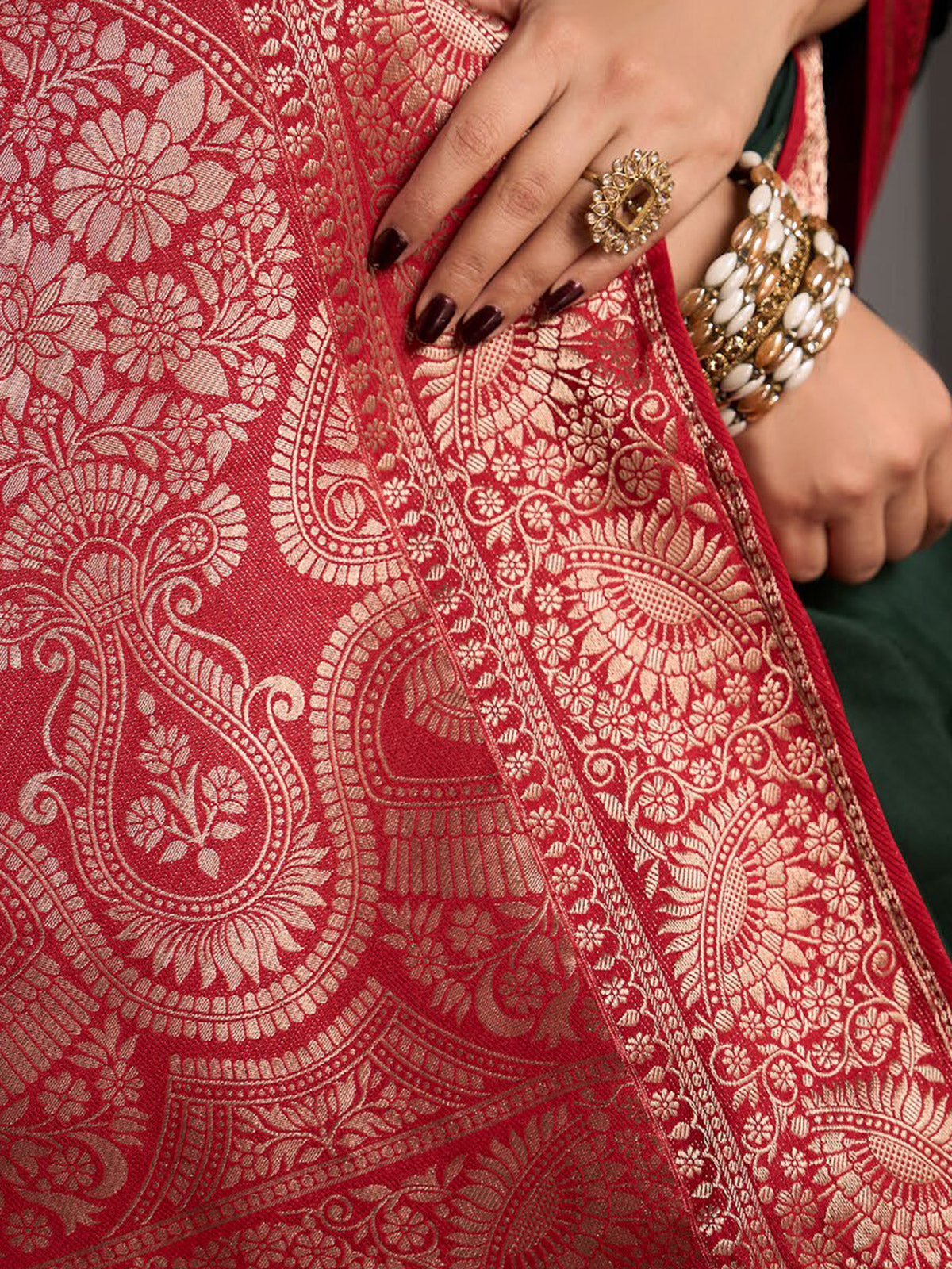 Deep green ornamental paisley women saree