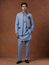 Sky blue waistcoat set with embellished brooch