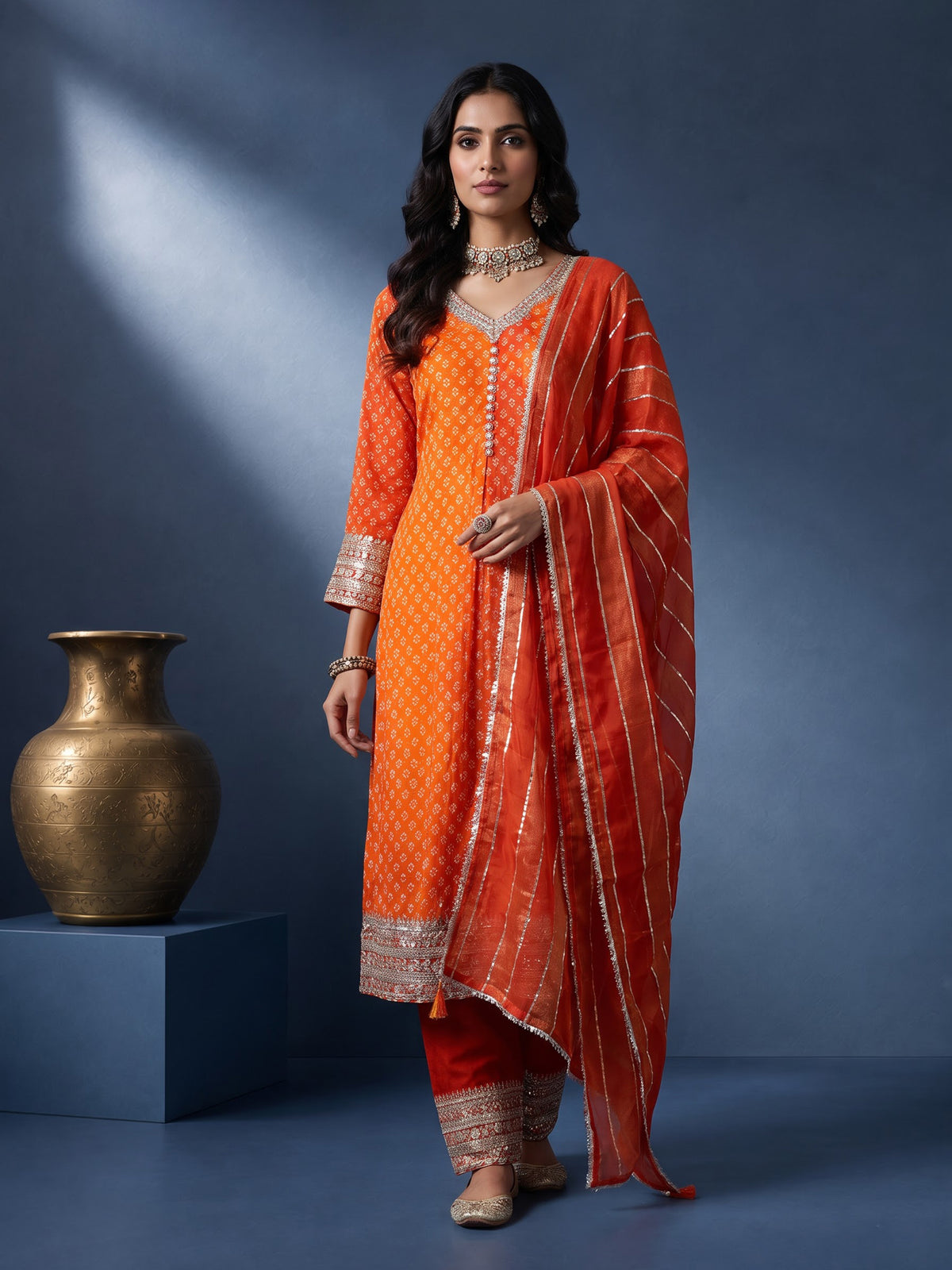 Rust orange modal silk anarkali suit with embroidered neckline