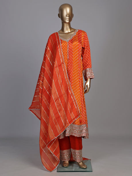 Rust orange modal silk anarkali suit with embroidered neckline